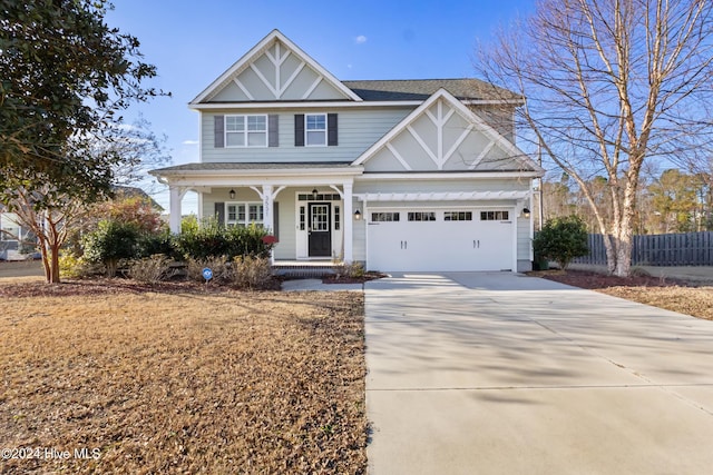 view of front of home with a garage and a front lawn