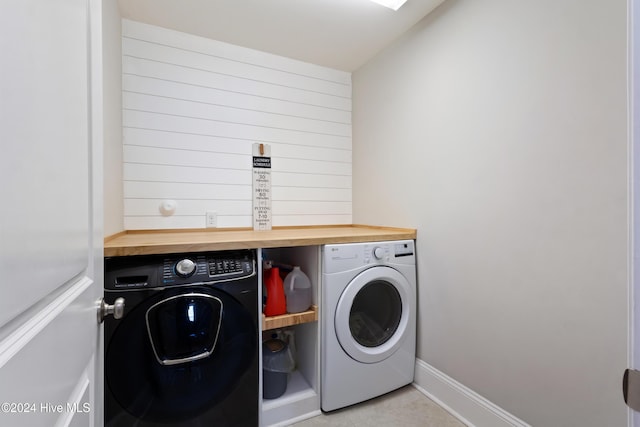 washroom featuring washer and dryer