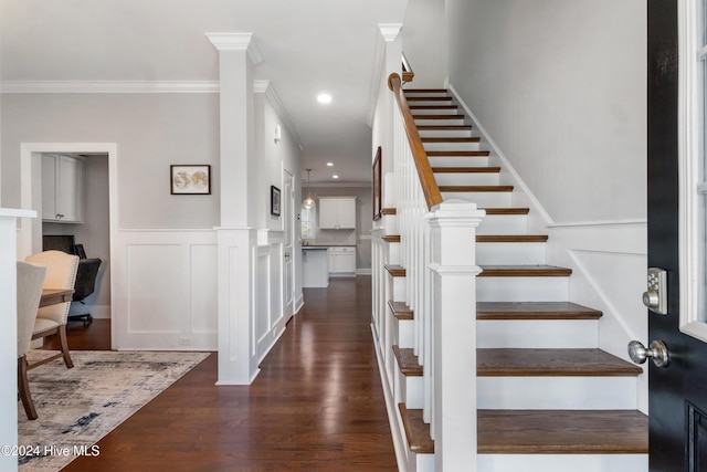 foyer featuring dark hardwood / wood-style flooring and ornamental molding