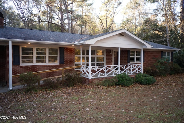 ranch-style house with covered porch