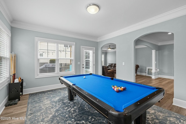 game room with pool table, a wealth of natural light, and hardwood / wood-style floors