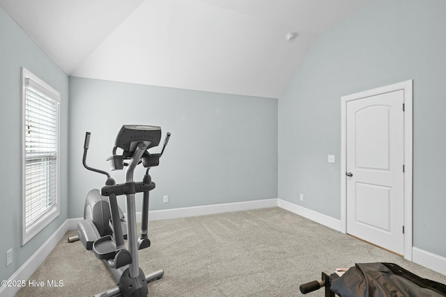 workout room with lofted ceiling and carpet floors