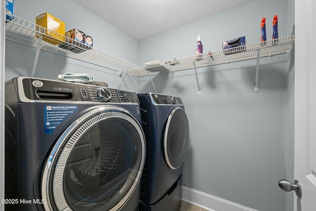 clothes washing area featuring washing machine and dryer