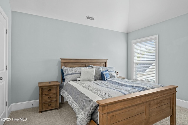 carpeted bedroom featuring lofted ceiling