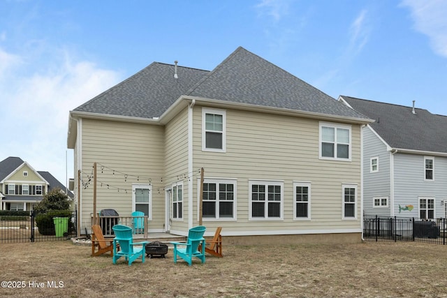 back of property featuring a fire pit