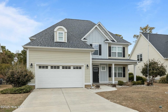 view of front of home featuring a porch and a garage