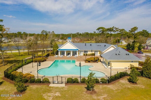 view of pool featuring a patio area and a lawn