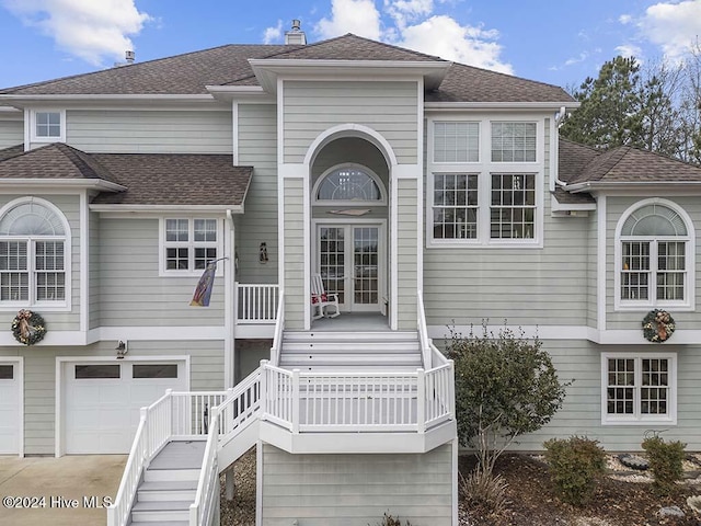 front facade with a garage