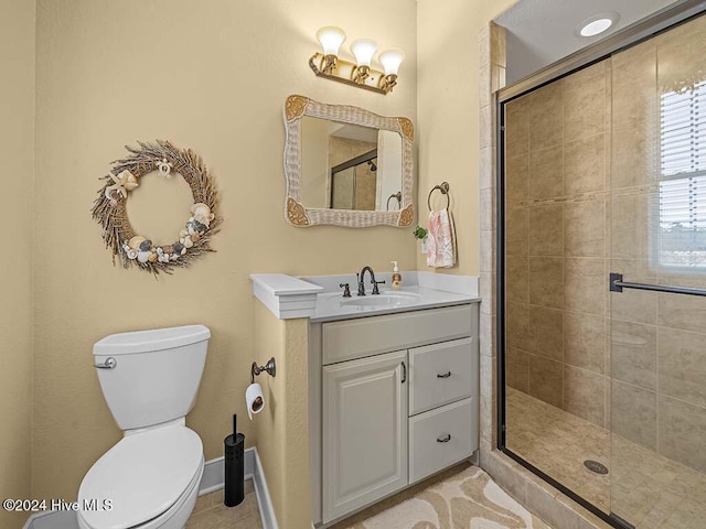 bathroom with tile patterned floors, toilet, and a shower with shower door