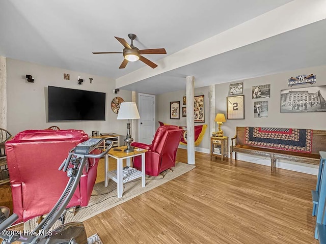 living room with ceiling fan and wood-type flooring