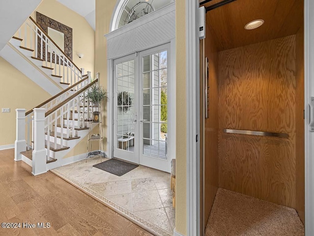 foyer featuring french doors and hardwood / wood-style flooring