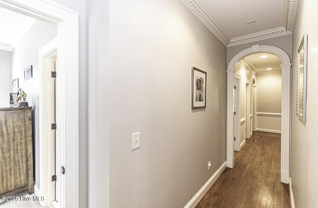 hallway featuring dark hardwood / wood-style flooring and crown molding