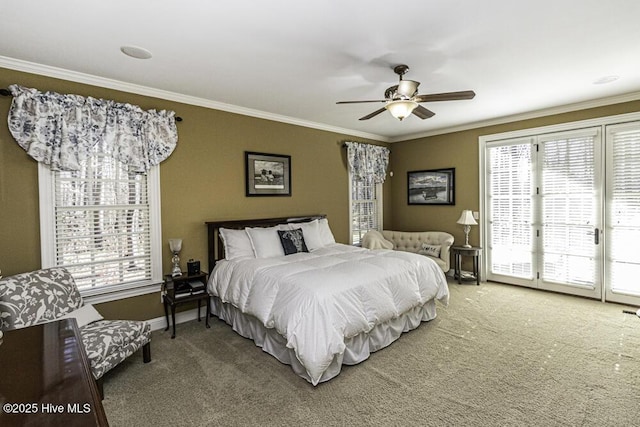 carpeted bedroom featuring ceiling fan, multiple windows, and ornamental molding