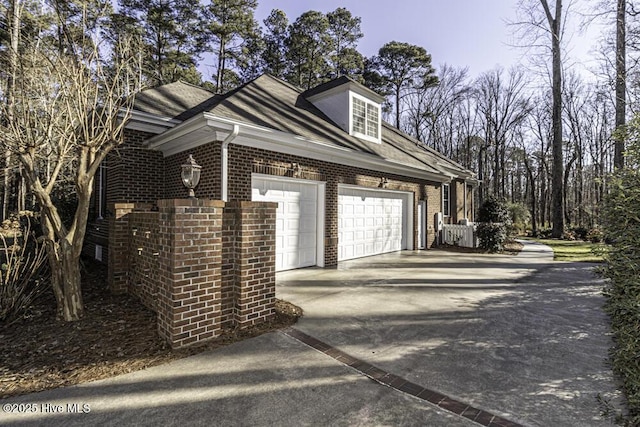 view of side of home with a garage