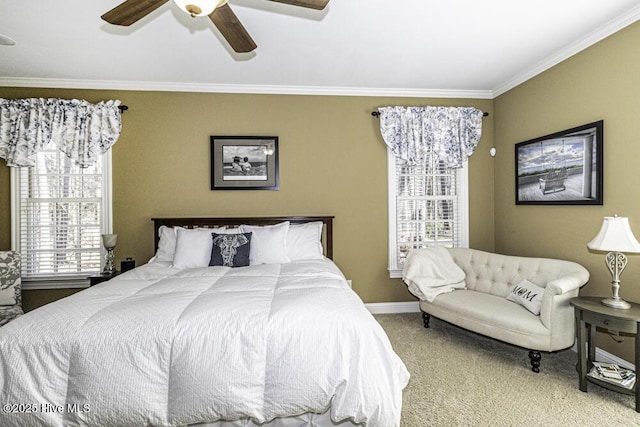 carpeted bedroom featuring ceiling fan, crown molding, and multiple windows