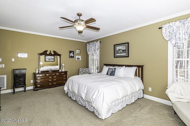 bedroom with ceiling fan, carpet, and ornamental molding