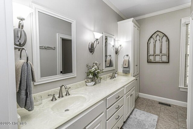 bathroom with ornamental molding, tile patterned floors, and vanity