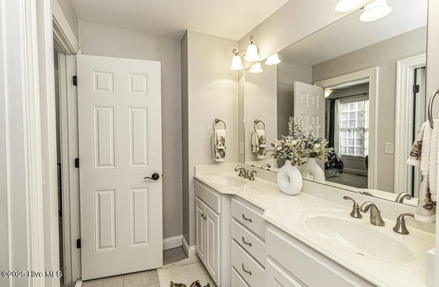 bathroom with vanity and tile patterned flooring