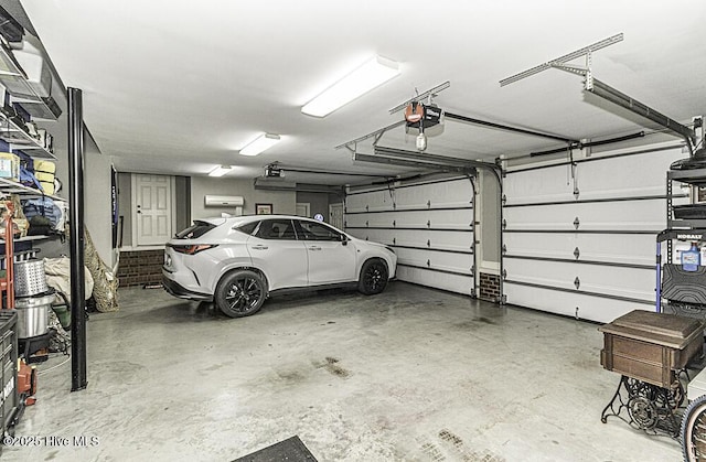 garage featuring a garage door opener and a carport