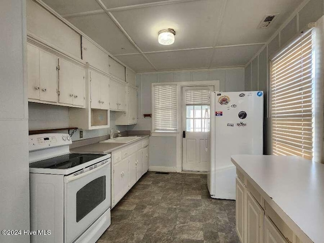 kitchen with white appliances and sink