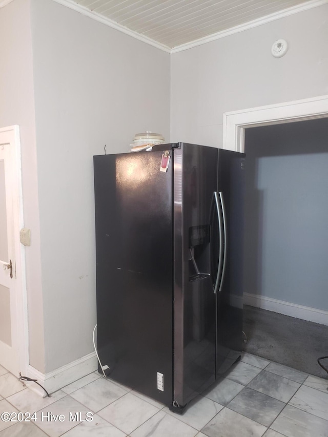 kitchen with black refrigerator with ice dispenser and ornamental molding