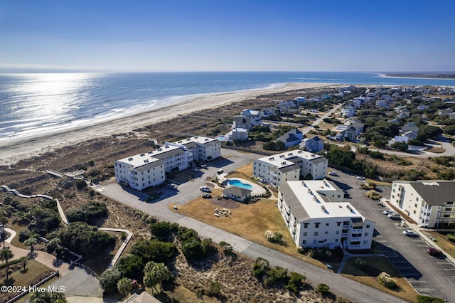 bird's eye view featuring a water view and a view of the beach