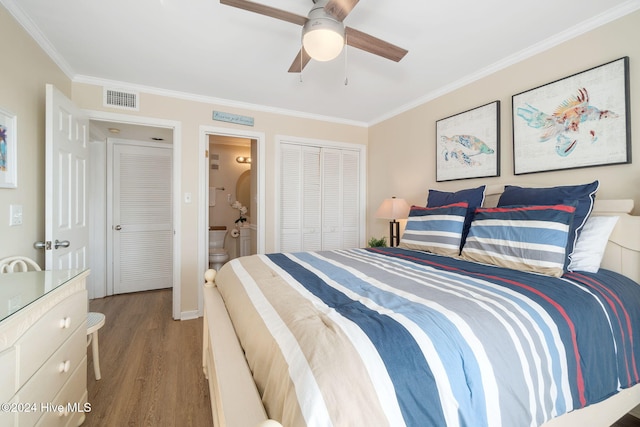 bedroom with ensuite bath, ceiling fan, crown molding, and hardwood / wood-style flooring