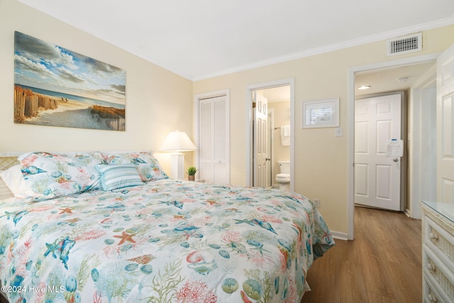 bedroom with light wood-type flooring, connected bathroom, a closet, and ornamental molding