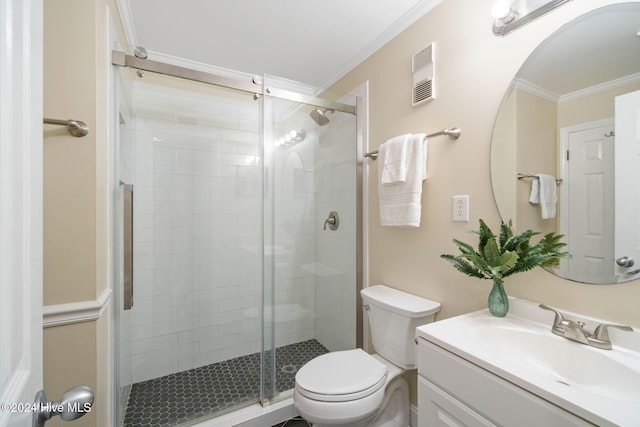 bathroom with vanity, toilet, ornamental molding, and walk in shower