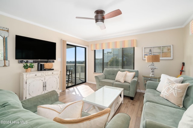 living room featuring ceiling fan, ornamental molding, and light hardwood / wood-style flooring