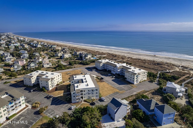 aerial view featuring a water view and a beach view