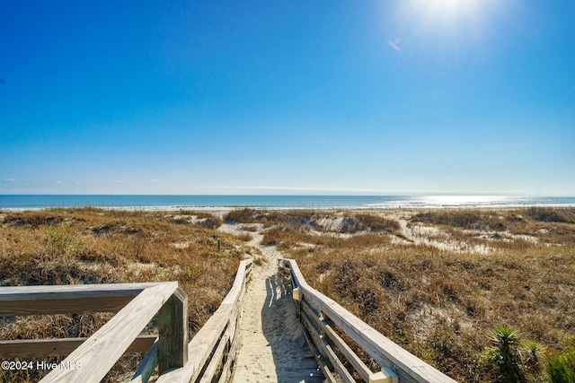 property view of water featuring a beach view