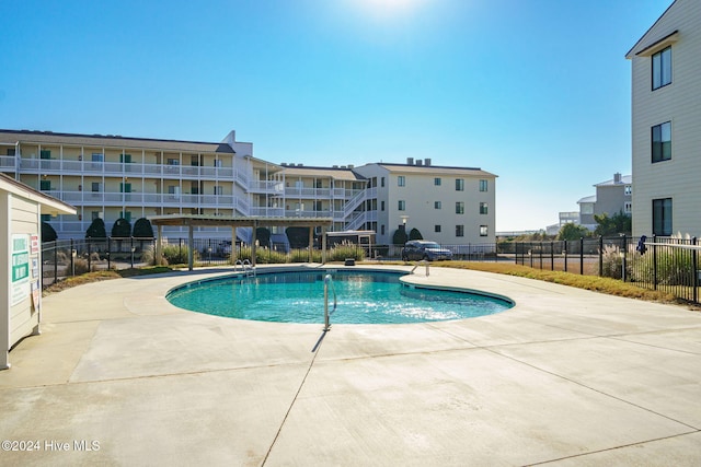 view of pool featuring a patio area