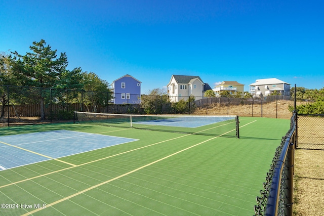 view of sport court with basketball hoop