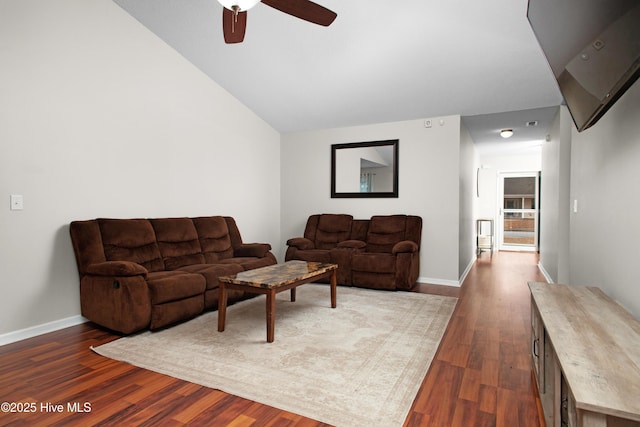 living room with ceiling fan and dark hardwood / wood-style floors