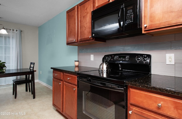 kitchen with backsplash, dark stone countertops, and black appliances