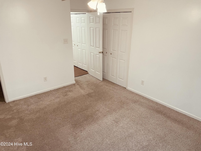 unfurnished bedroom featuring carpet floors