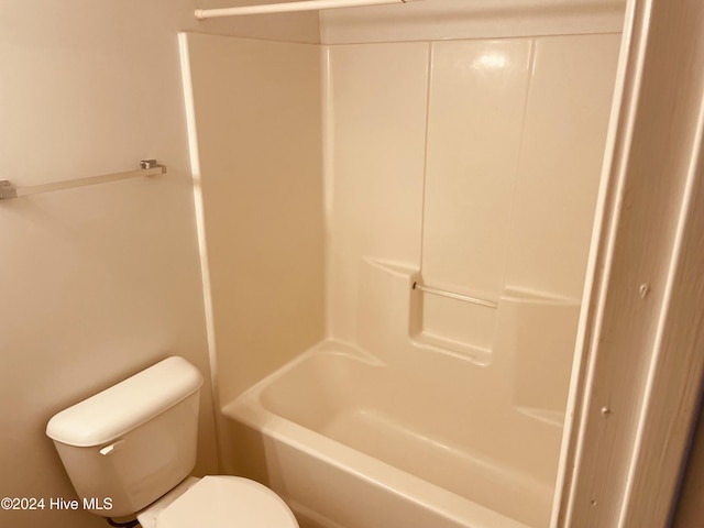 bathroom with shower / bath combination and toilet