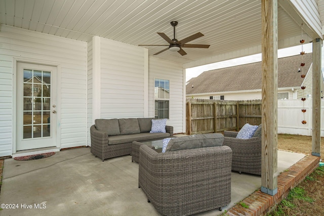 view of patio with an outdoor living space and ceiling fan