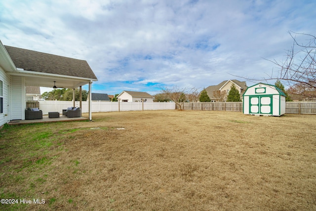 view of yard featuring an outdoor hangout area and a shed