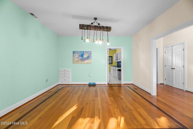 interior space with a healthy amount of sunlight, french doors, and light hardwood / wood-style floors