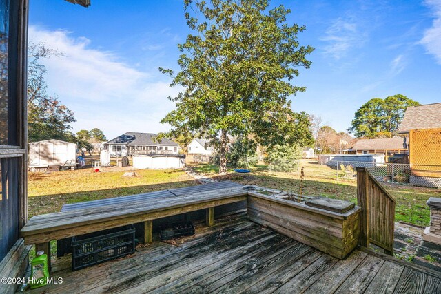 back of property featuring a lawn and a sunroom