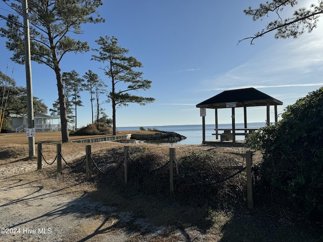 exterior space featuring a gazebo and a water view