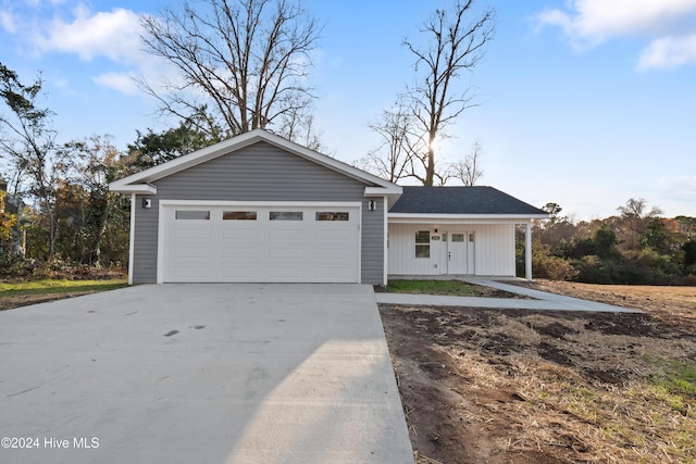 view of front of house with a porch and a garage