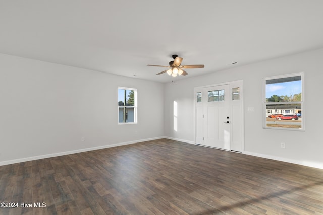 spare room featuring dark hardwood / wood-style floors and ceiling fan