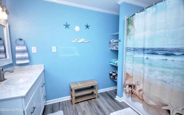 bathroom featuring vanity, shower / bath combo, wood-type flooring, and crown molding