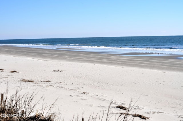 view of water feature with a beach view