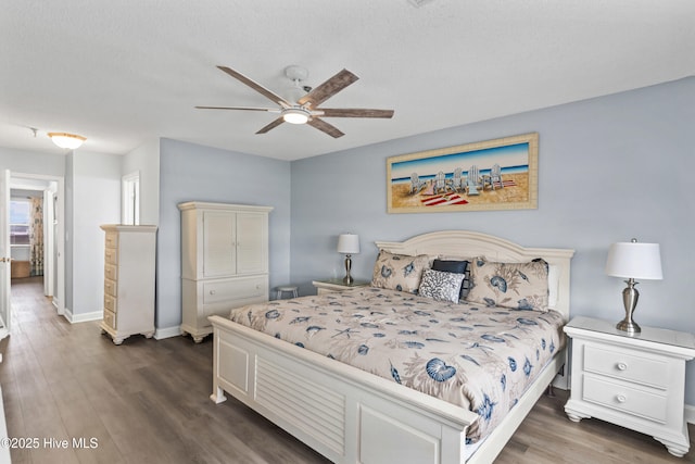 bedroom featuring ceiling fan and dark hardwood / wood-style floors