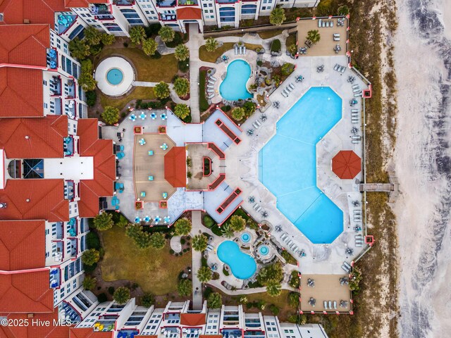 bird's eye view featuring a view of the beach and a water view