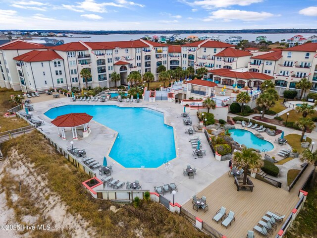 birds eye view of property featuring a water view and a view of the beach